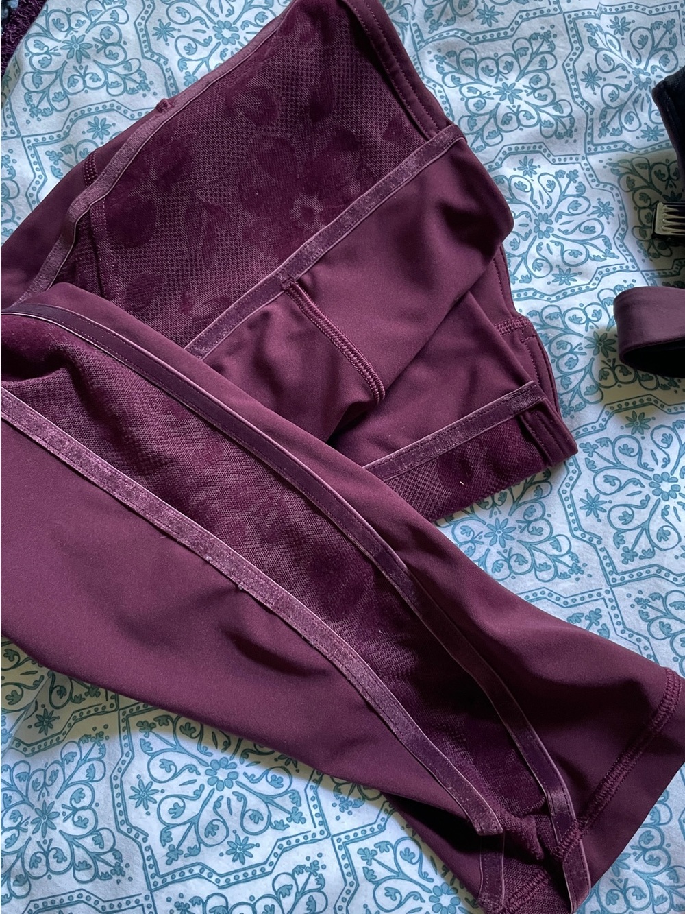 Lululemon Plum High-Waist Leggings with Side Lace Panels: Feminine and Sleek.